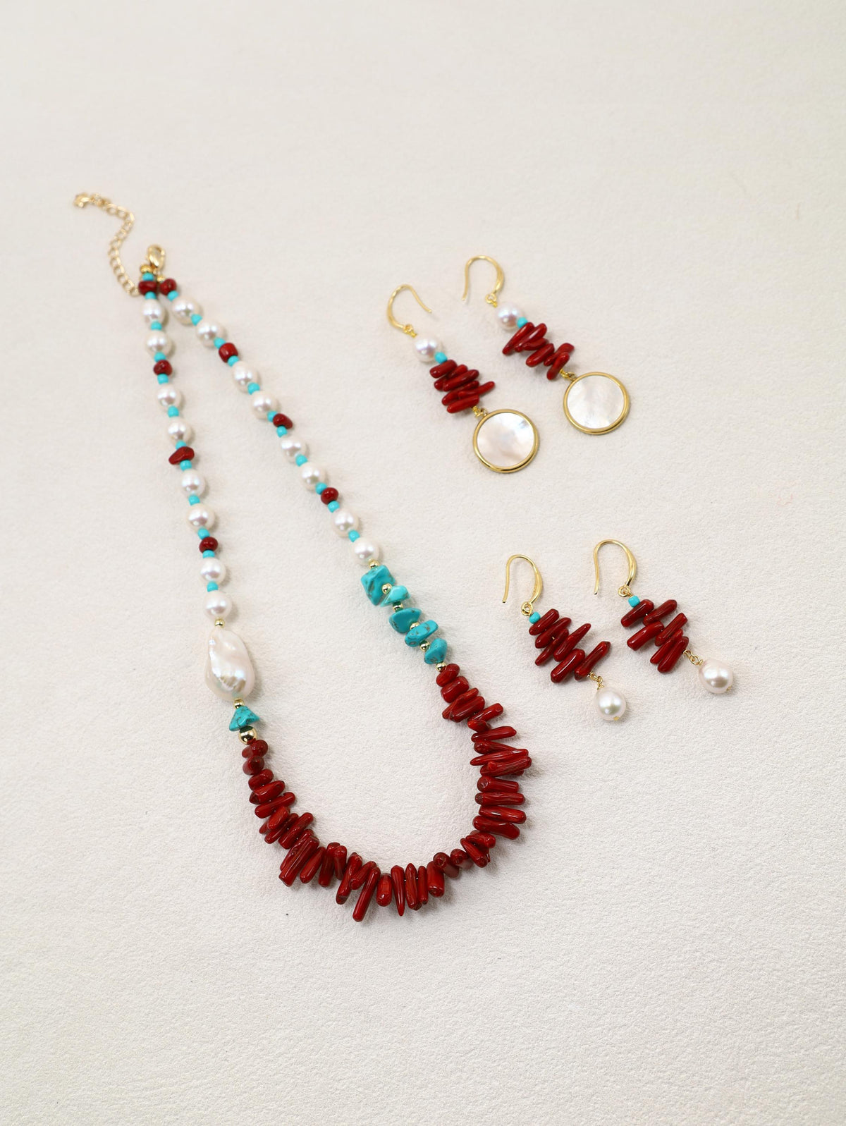 Elopement Necklace displayed with Scarlet Orbit and Scarlet Tide Earrings