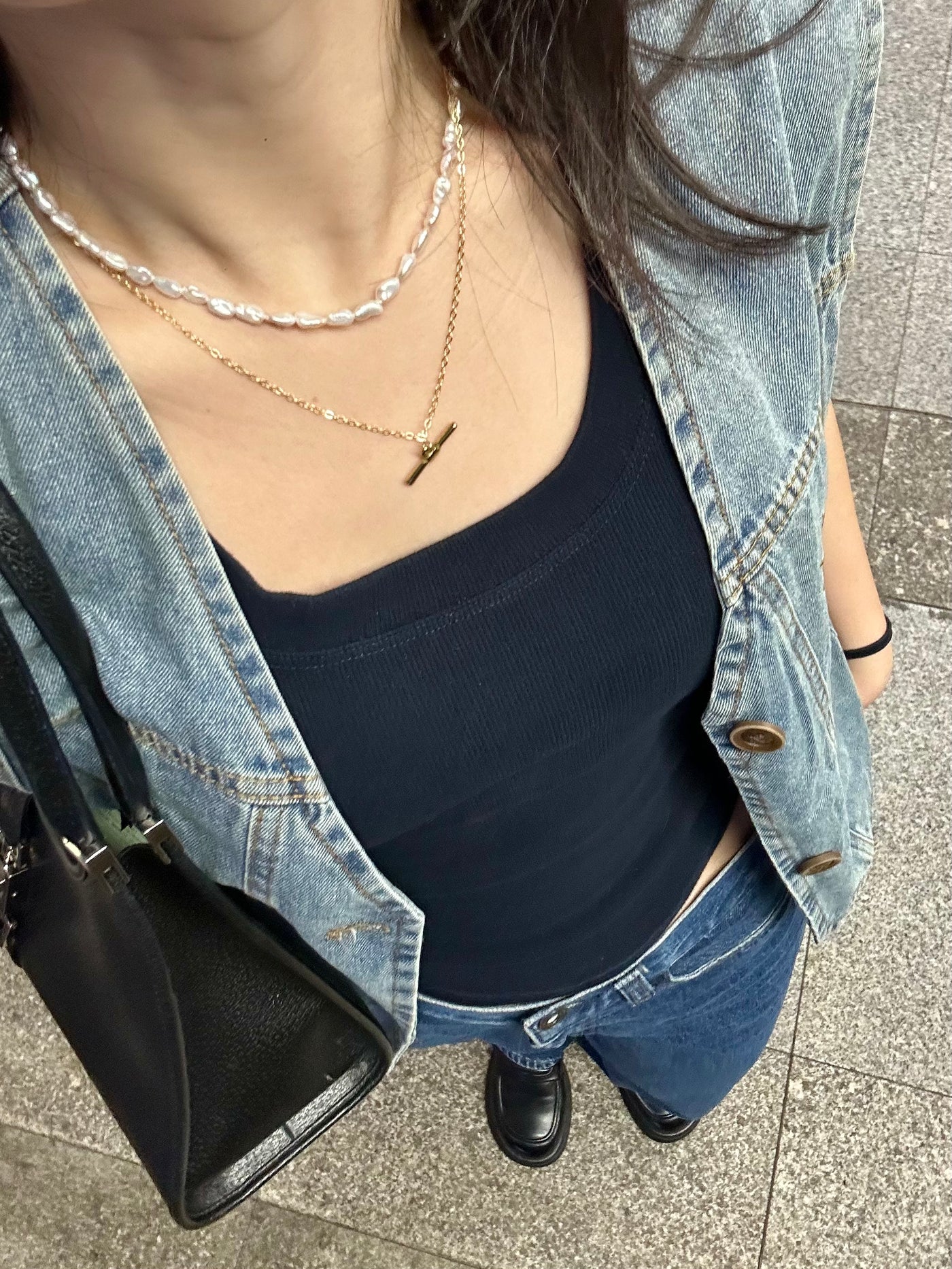 Pearl necklaces styled with a denim outfit on an everyday walk
