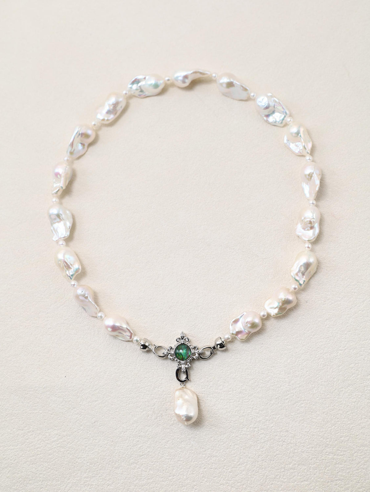 Siren’s Tail Necklace with baroque pearls and silver-toned pendant detail