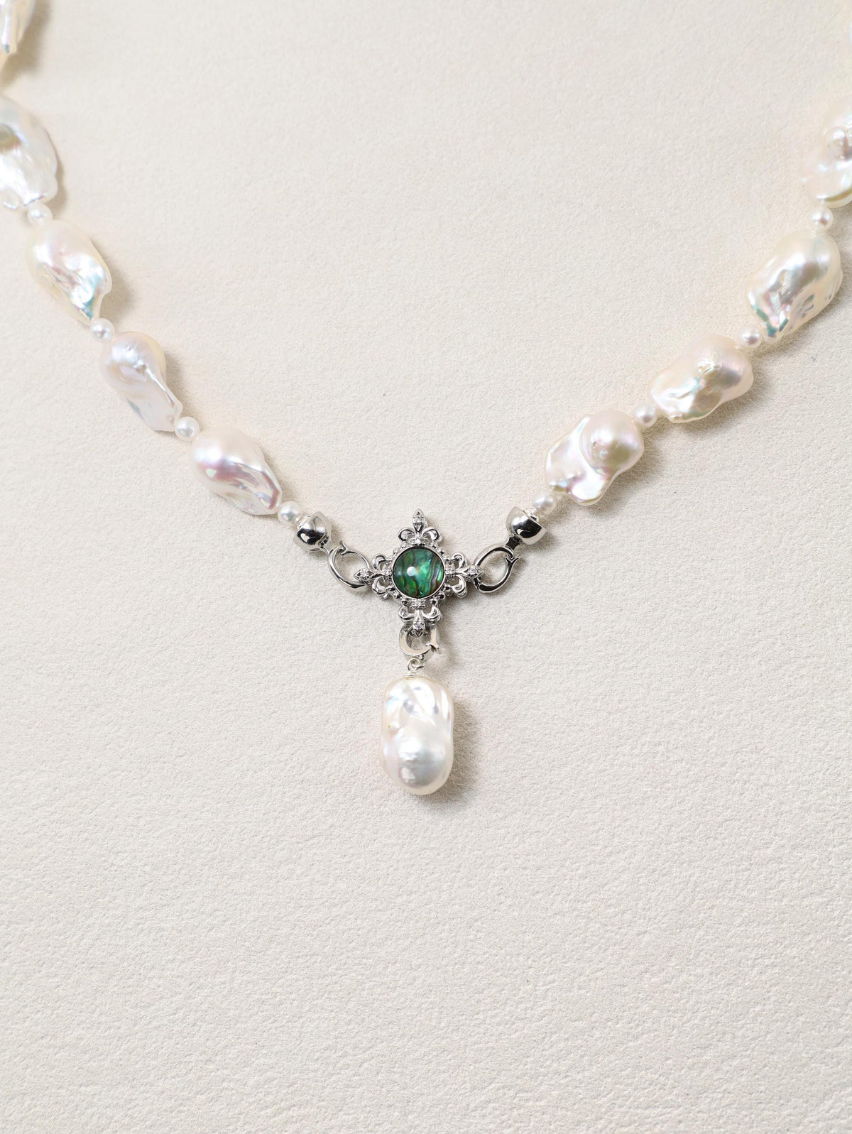 Siren’s Tail Necklace with baroque pearls and silver-toned pendant detail