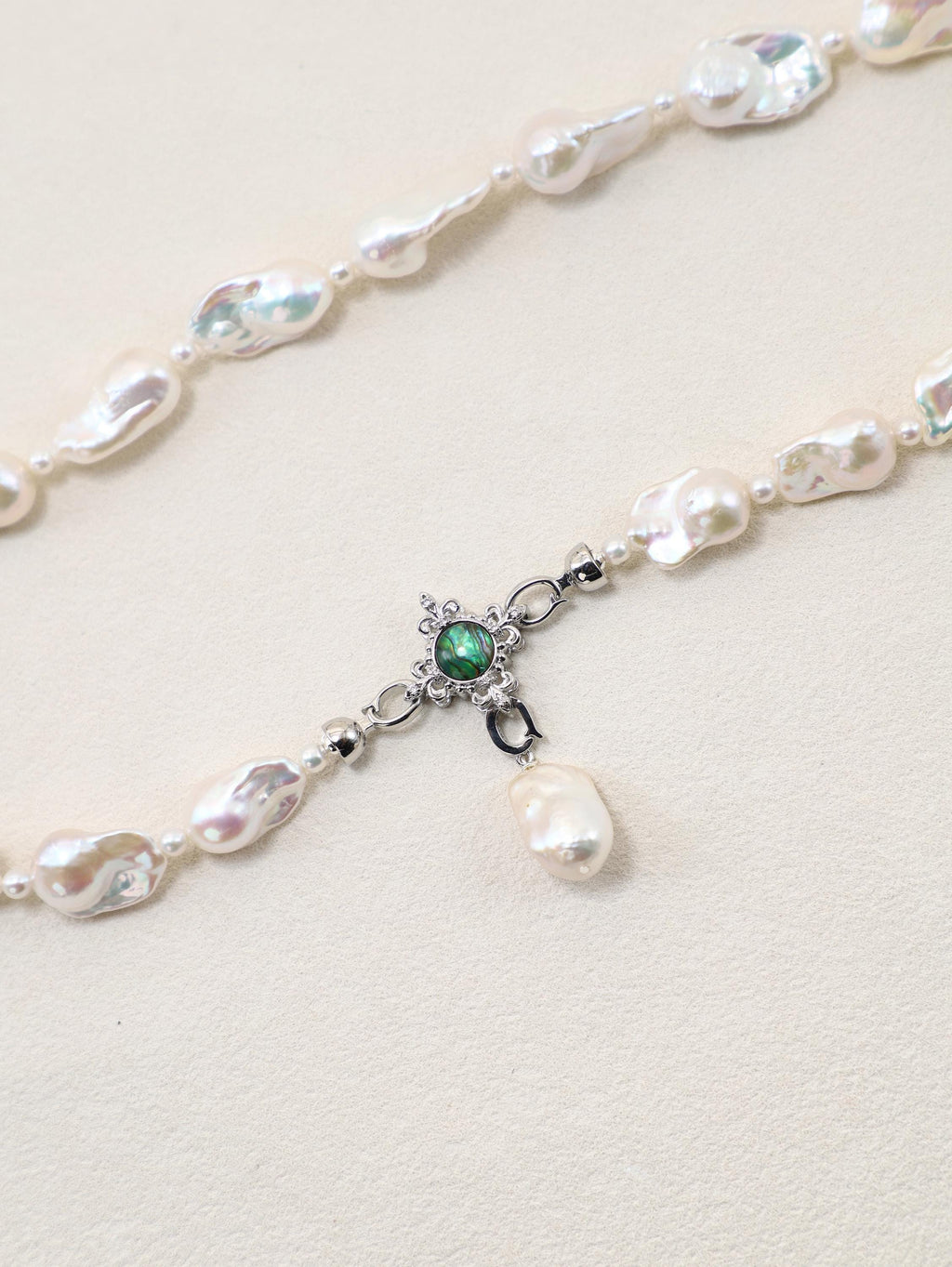 Siren’s Tail Necklace with baroque pearls and silver-toned pendant detail