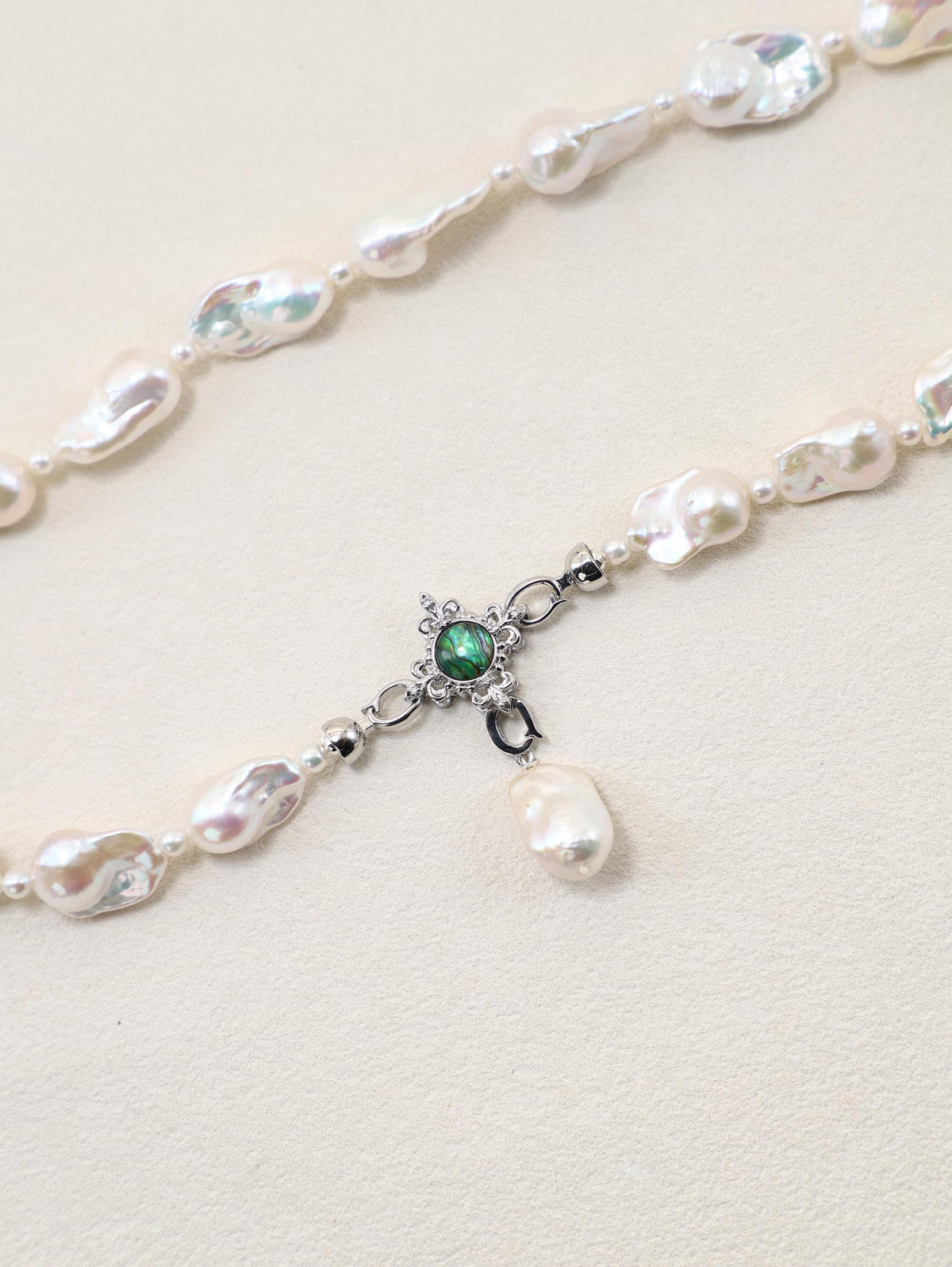 Siren’s Tail Necklace with baroque pearls and silver-toned pendant detail